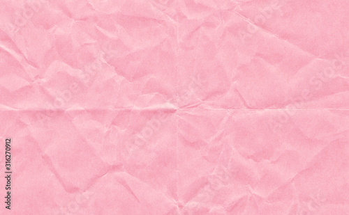 Closeup crumpled light pink paper texture background, texture.Pink paper sheet board with space for text ,pattern or abstract background.