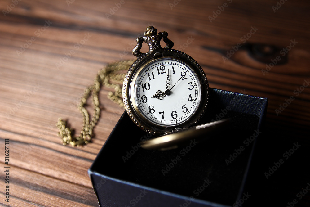 a pocket watch with book background a pocket watch with book background