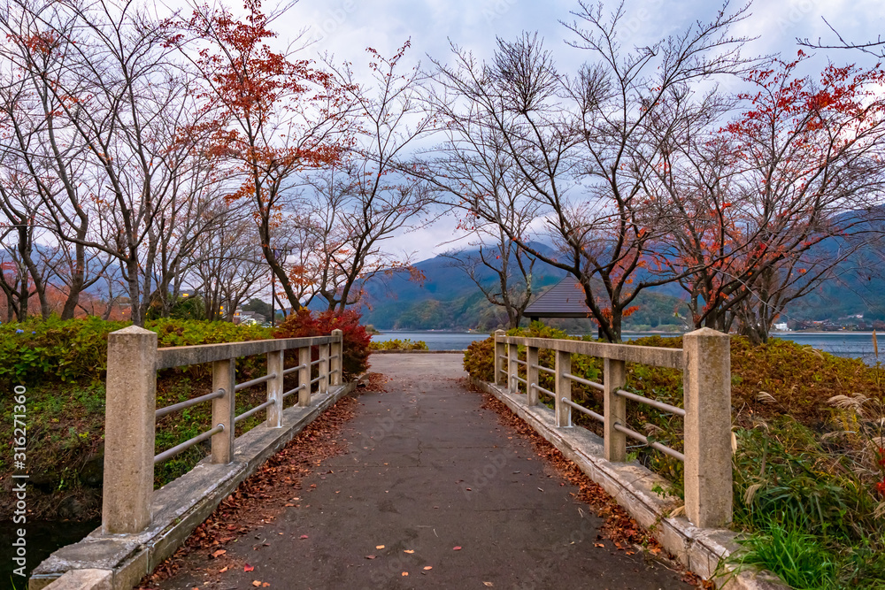Kawaguchiko Lake. Japan. Stone bridge to the lake. Nature of the village of Fujikawaguchiko. Drive to Kawaguchiko Lake. Japan park. Sights of Fujikawaguchiko. Japan travel guide. Visit to East Asia
