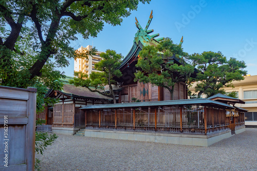 Osaka. Japan. Shirokata Tenmangu Shrine. Travel to temples of Japan. Shirokata Tenmangu Shrine against the blue sky. Buddhist temple architecture. Guide to the temples of Osaka. Religion in East Asia photo