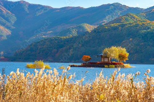 Kawaguchiko Lake. Japan. Five Fuji Lakes. Mountains near lake Kawaguchiko. Nature of East Asia. Japan landscape. Single tour to kawaguchiko lake. Vacation in Fujikawaguchiko. Gazebo on the island photo