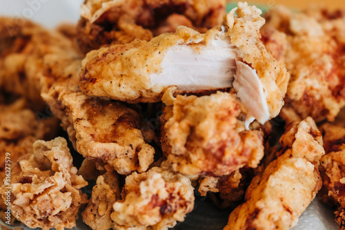 close-up of crispy and juicy fried chicken on a plate. 