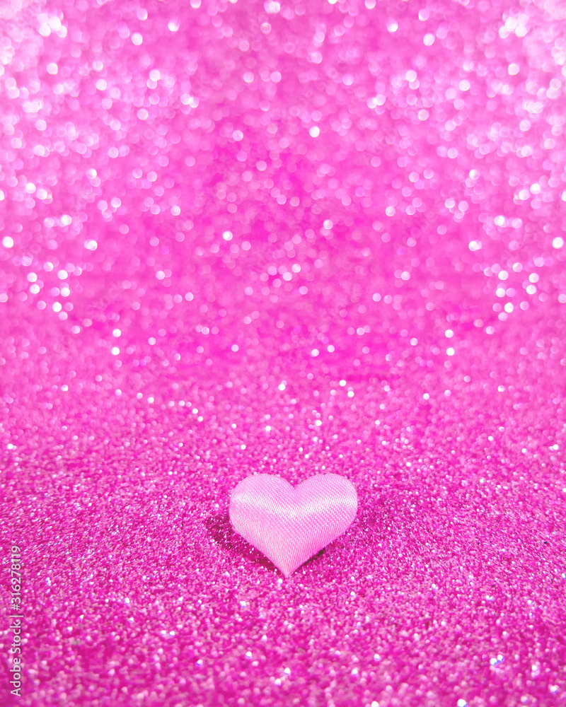 pink heart on a blurry, not sharp pink background with bokeh. Place for text. Valentine's Day
