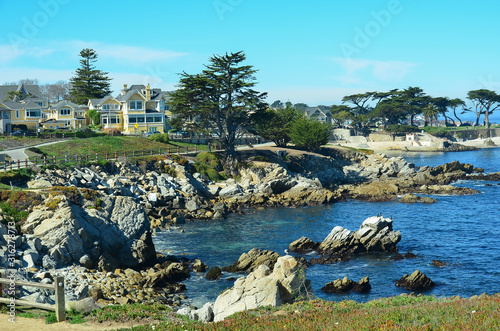 Picturesqe Monterey Peninsula in California, USA. Scenic drive between Monterey and the quaint town of Carmel winds along the ocean on one side and upscale homes and golf courses on the other. photo