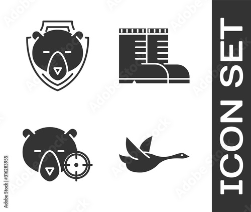Set Flying duck, Bear head on shield, Hunt on bear with crosshairs and Hunter boots icon. Vector