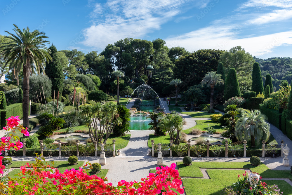 Formal public garden of Rothschild house on French Riviera in summertime