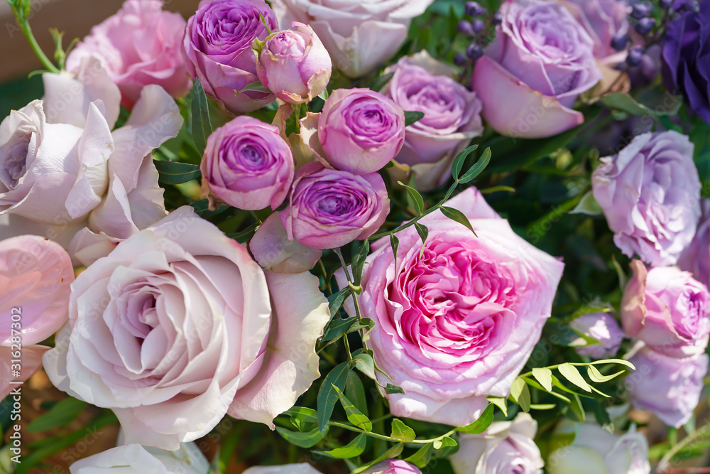 Bouquets of fresh flowers decoration of the festive table. Celebrating an open air party. Decor Details Bouquets of fresh flowers decoration of the festive table. Celebrating an open air party. Decor Details