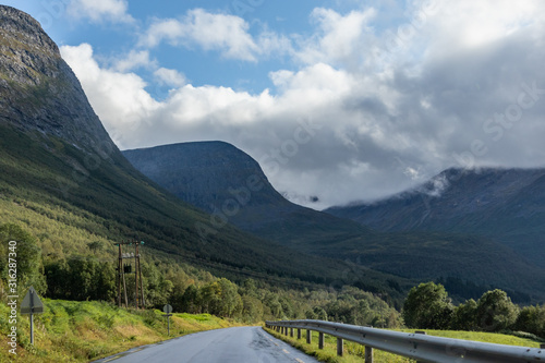 Mountains cloudy road in scandinavia nature travel