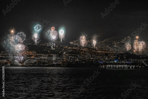 Fototapeta Naklejka Na Ścianę i Meble -  Fireworks show on New Year's Eve night in Funschal Madeira
