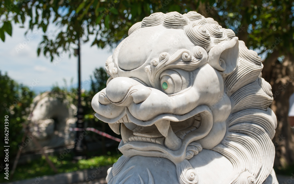 Vietnamese dragon. A symbolic creature in Vietnamese mythology. The statue is made of white marble. Vietnamese dragon. A symbolic creature in Vietnamese mythology. The statue is made of white marble.
