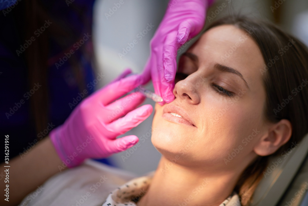Brunette woman having a cosmetic treatment