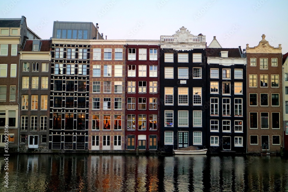 Reflection of Amsterdam houses in the canal