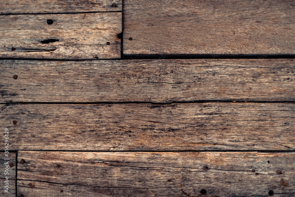 Dark brown wood texture with natural striped pattern background Dark brown wood texture with natural striped pattern background