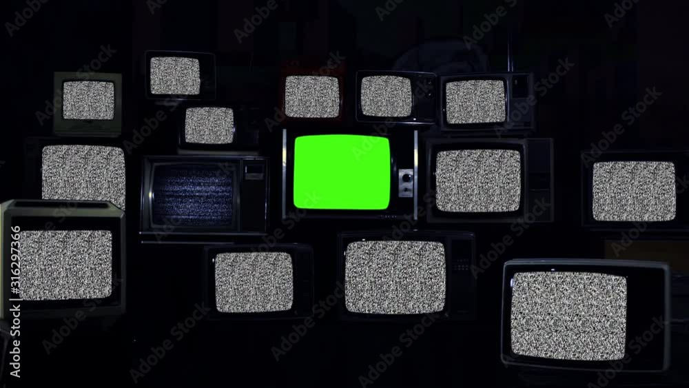 Vidéo Stock Old Retro TVs with Noise and One Vintage Television turning