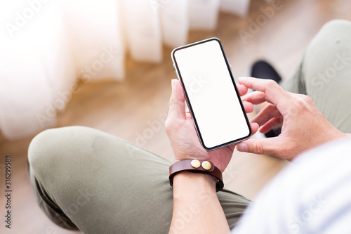 Mockup image blank white screen cell phone.woman hand holding texting using mobile.background empty space for advertise text.people contact marketing business,technology 