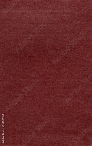 Artificial leather texture. Red old book cover. Rough surface with embossed. Blank retro page. Empty place for text. Perfect for background and vintage style design.