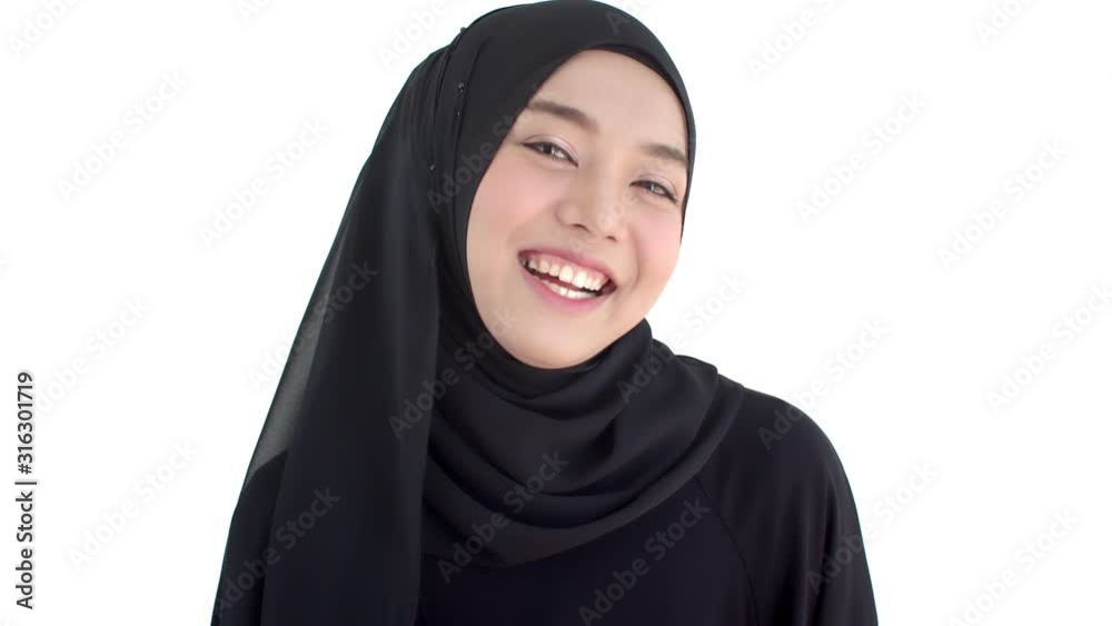 Portrait beautiful Muslim woman wearing traditional clothing smiling with shyness Portrait beautiful Muslim woman wearing traditional clothing smiling with shyness