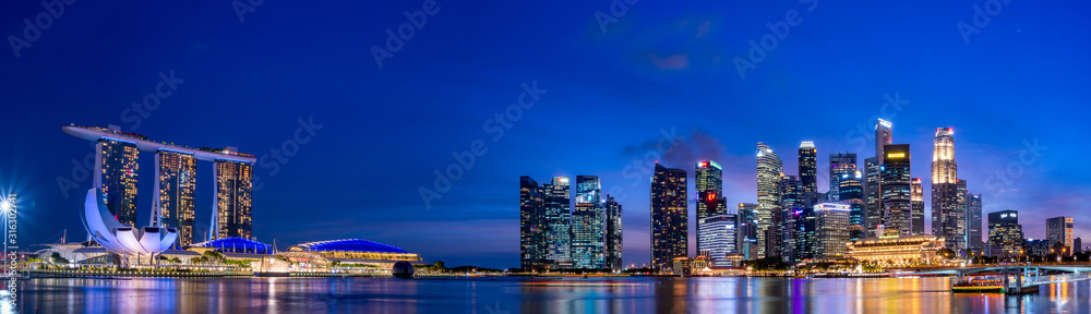 Super wide panorama of Singapore skyscrapers at magic hour