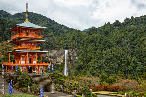 Three Story Pagoda of Seigantoji Temple with the Nachi fall on the background. Wakayama. Japan.