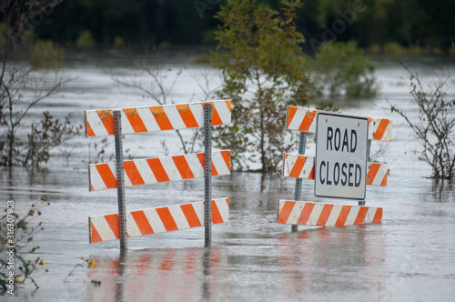 Fototapet Flooding causes closures on a rural Iowa road.