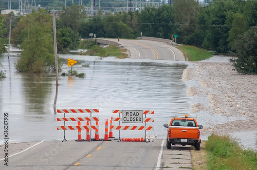 Fotografia, Obraz Flooding causes closures on a rural Iowa road.