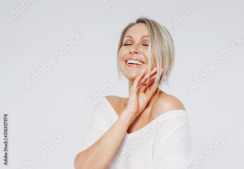Fototapeta Beauty portrait of blonde smiling laughing woman 35 year plus clean fresh face w