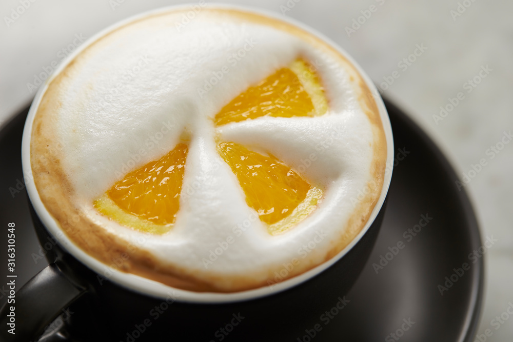 Cafe latte, latte art with orange Cafe latte, latte art with orange