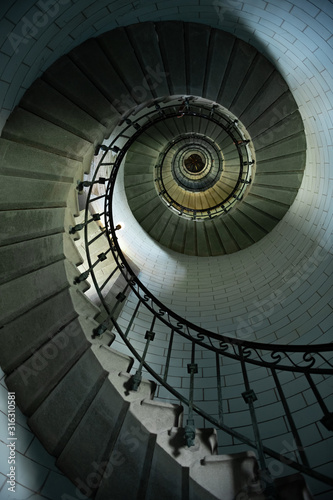 Beautiful spiral staircase to the top of Eckmuhl lighthouse, on the Penmarsh Peninsula. Brittany. France
