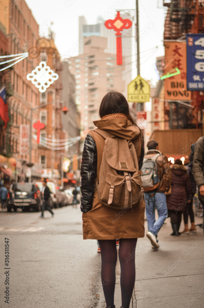 Woman in one of street from Chinatown, New York