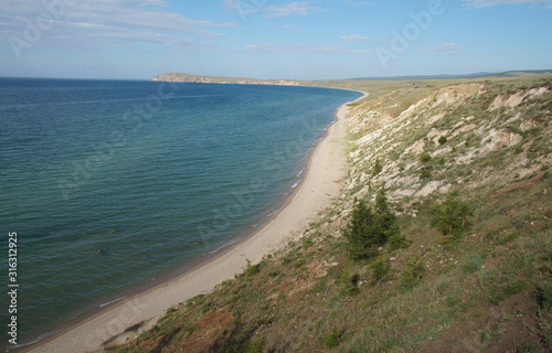 long the coast of beatifull lake and calm blue water © valeriysemen0415