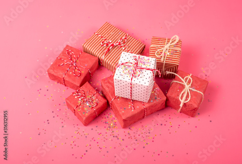 birthday gifts on a pink background