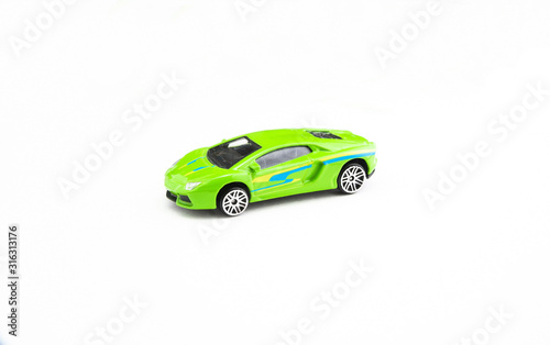 green toy racing car on a white background
