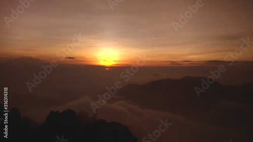 Foggy sunrise while rainy season