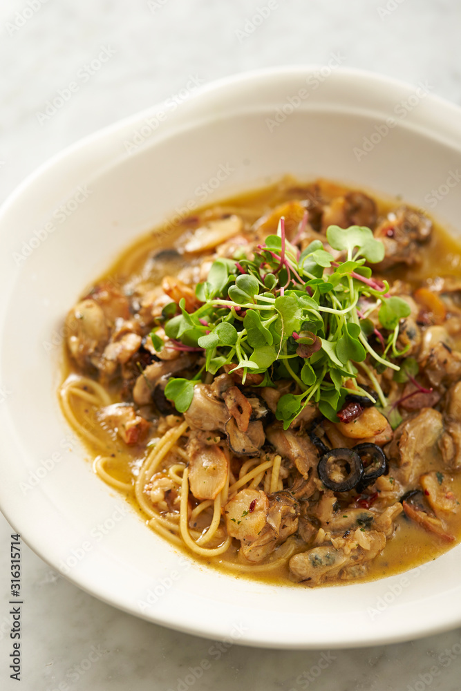 Oyster and garlic spaghetti studio shot Oyster and garlic spaghetti studio shot