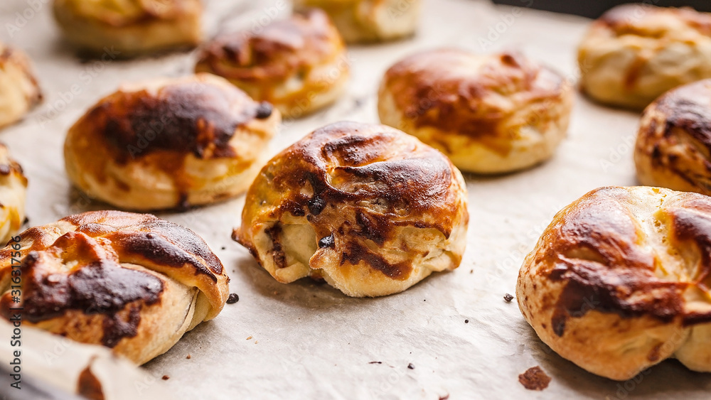 Food banner homemade sweet buns with salted caramel and nuts. Selective focus. Close up Food banner homemade sweet buns with salted caramel and nuts. Selective focus. Close up