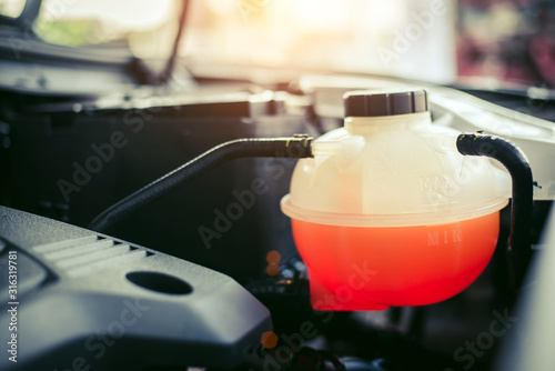 Фотография Close up of Coolant tank,Checking coolant level of car.