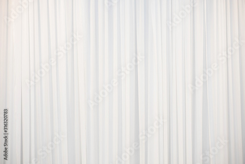  The white curtain that dropped down as a straight line.Background for inserting text on empty spaces.. photo