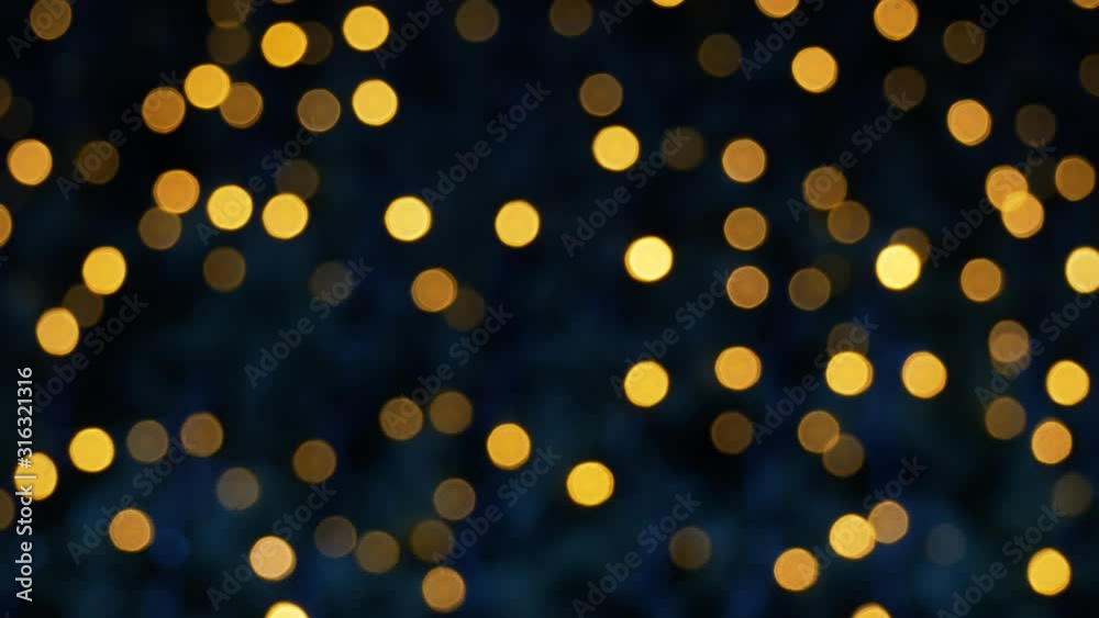Moving yellow bokeh lights panorama. Abstract blurred Christmas lights bokeh background 4k