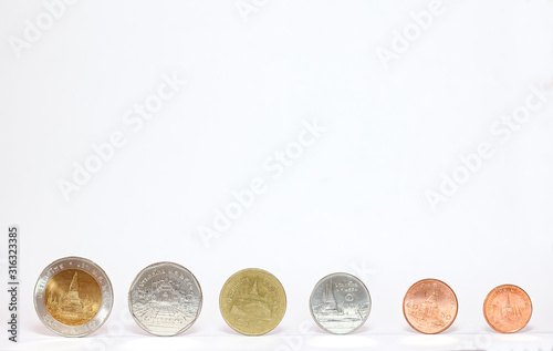 Top view of Tahiland currency coins isolate on white background