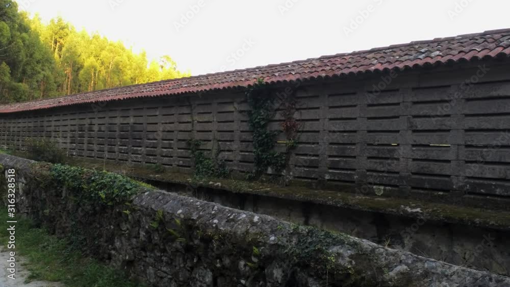 Scenic shot of long granary Horreo de Arano in Galicia, Spain Scenic shot of long granary Horreo de Arano in Galicia, Spain