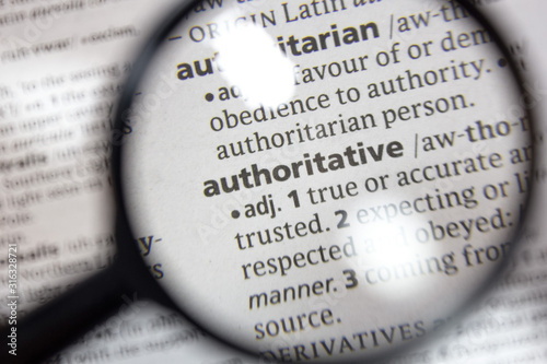 The word of phrase - authoritative - in a dictionary. photo