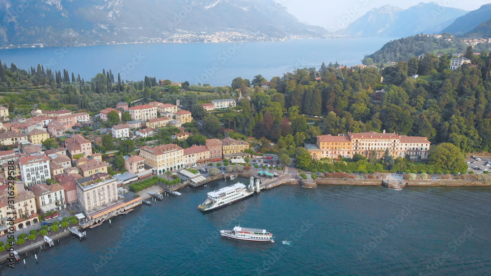 Aerial view. In the frame is the famous Italian city of Bellagio. The spa town is located in the center of Lake Como. Ancient villas and houses are inscribed in a beautiful hilly landscape