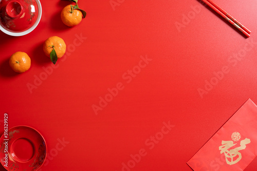 red background flatlay with chinese lunar new year elements