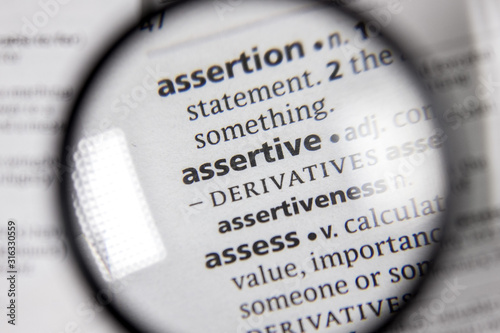 The word or phrase assertive in a dictionary.