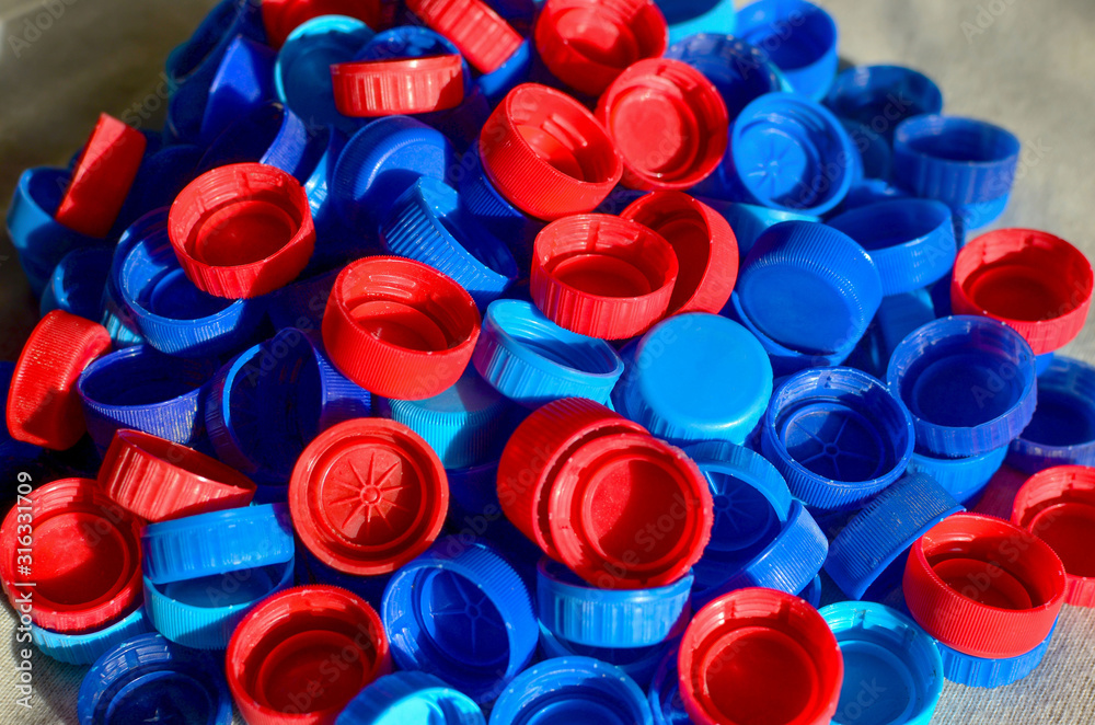 Plastic bottle caps background. Cap material is recyclable.Remove lids