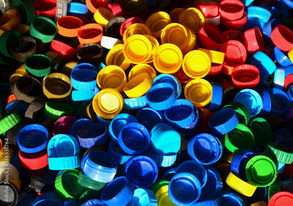 Plastic bottle caps background. Cap material is recyclable.Remove lids