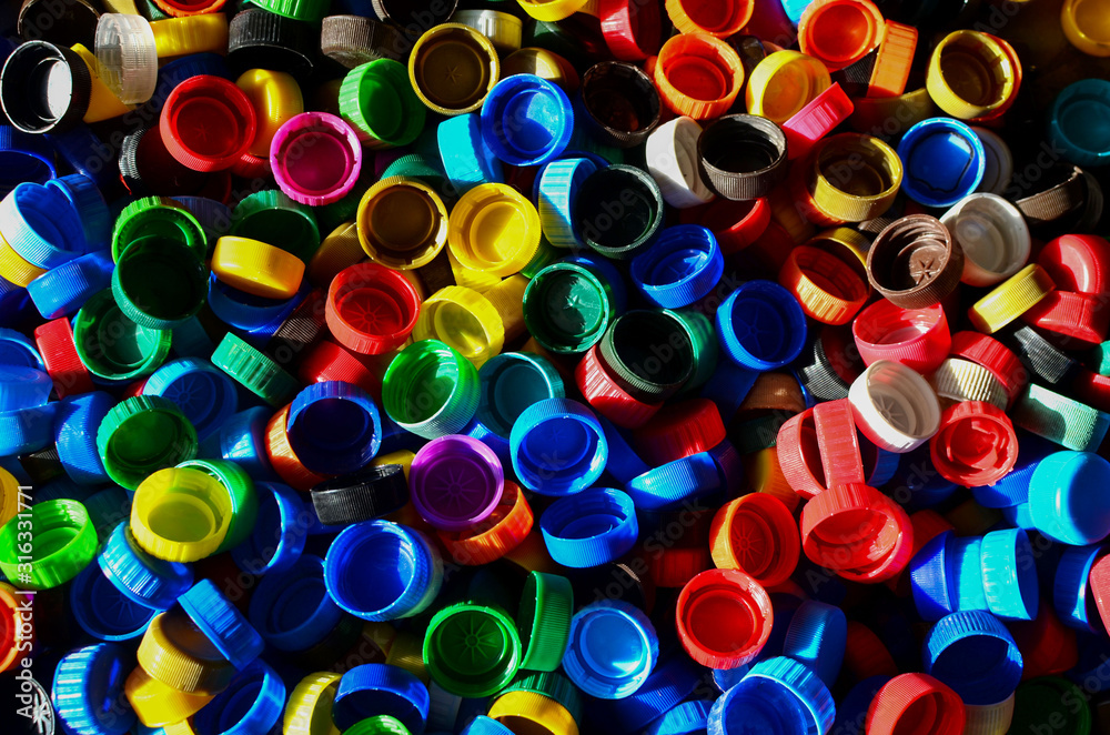 Plastic bottle caps background. Cap material is recyclable.Remove lids