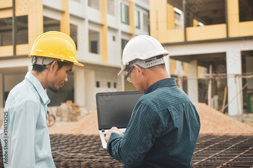 Businessman use computer talking on work site estate building construction