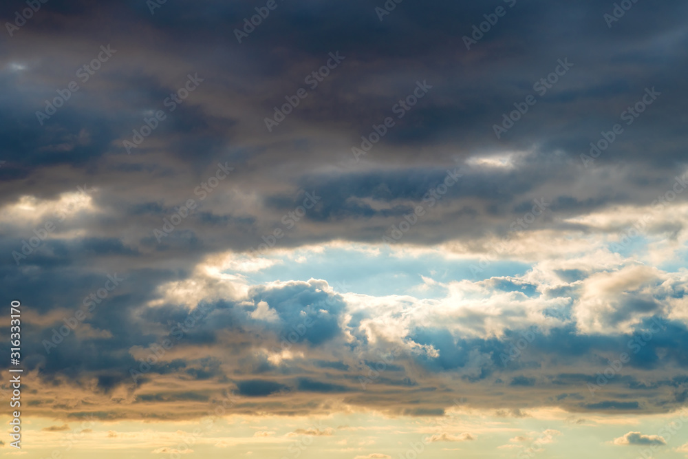 Beautiful sky landscape, blue and yellow sky, amazing view of the space between the clouds, the sacred beauty of nature