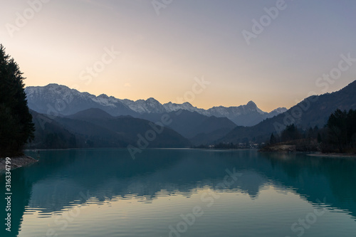 The twilight sunset over the lake Barcis, Italy